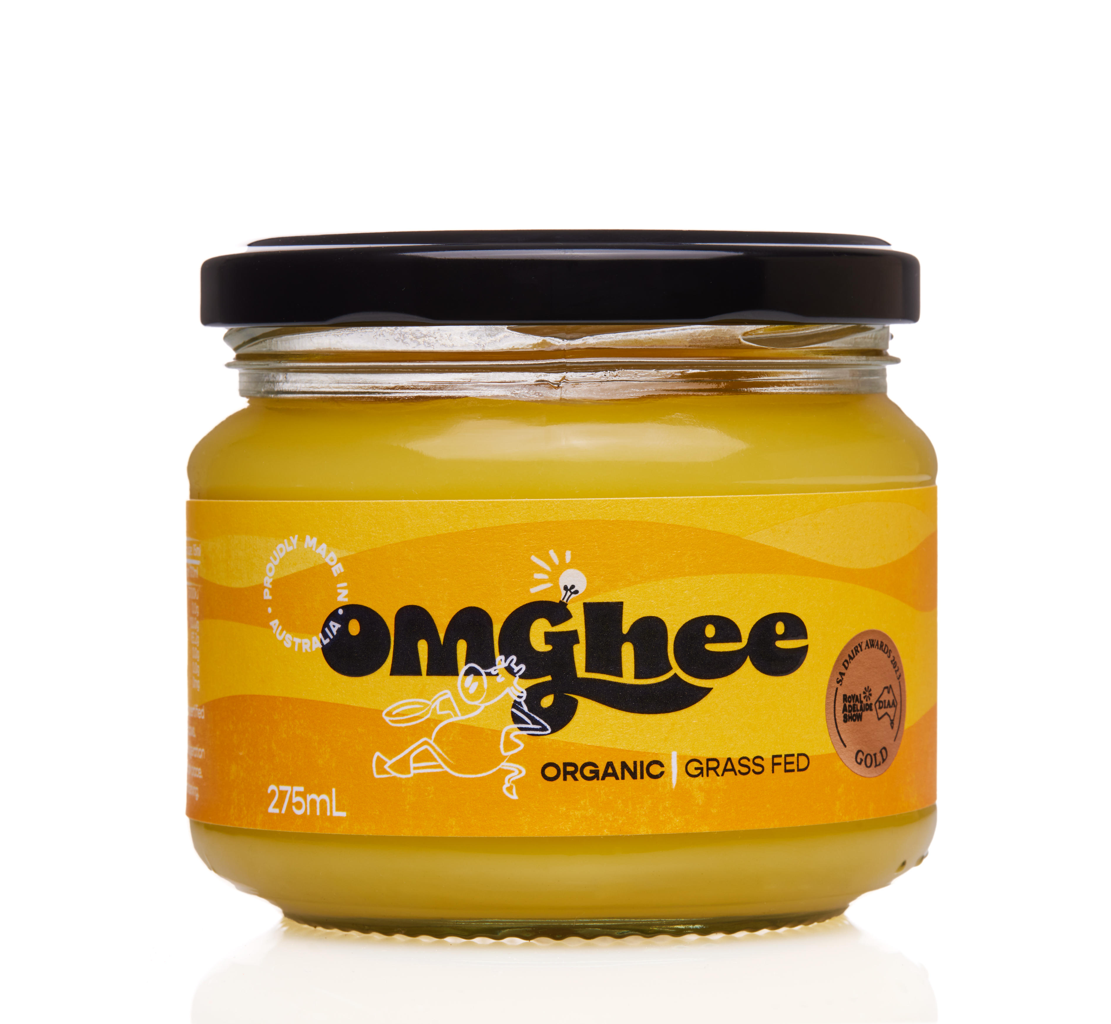 Organic grass-fed ghee in a clear glass jar with a black lid