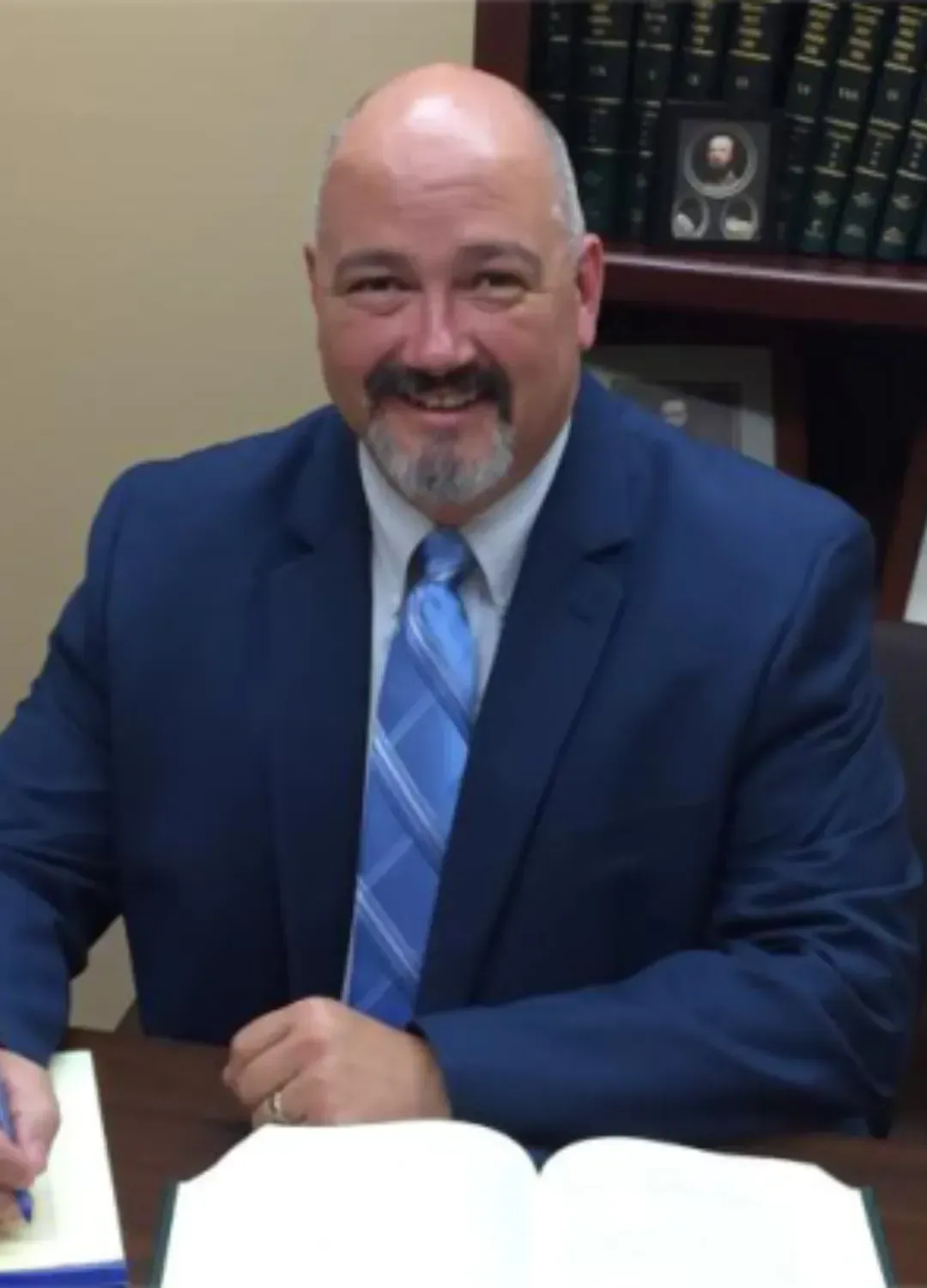 Real estate attorney reviewing contract details with a pen