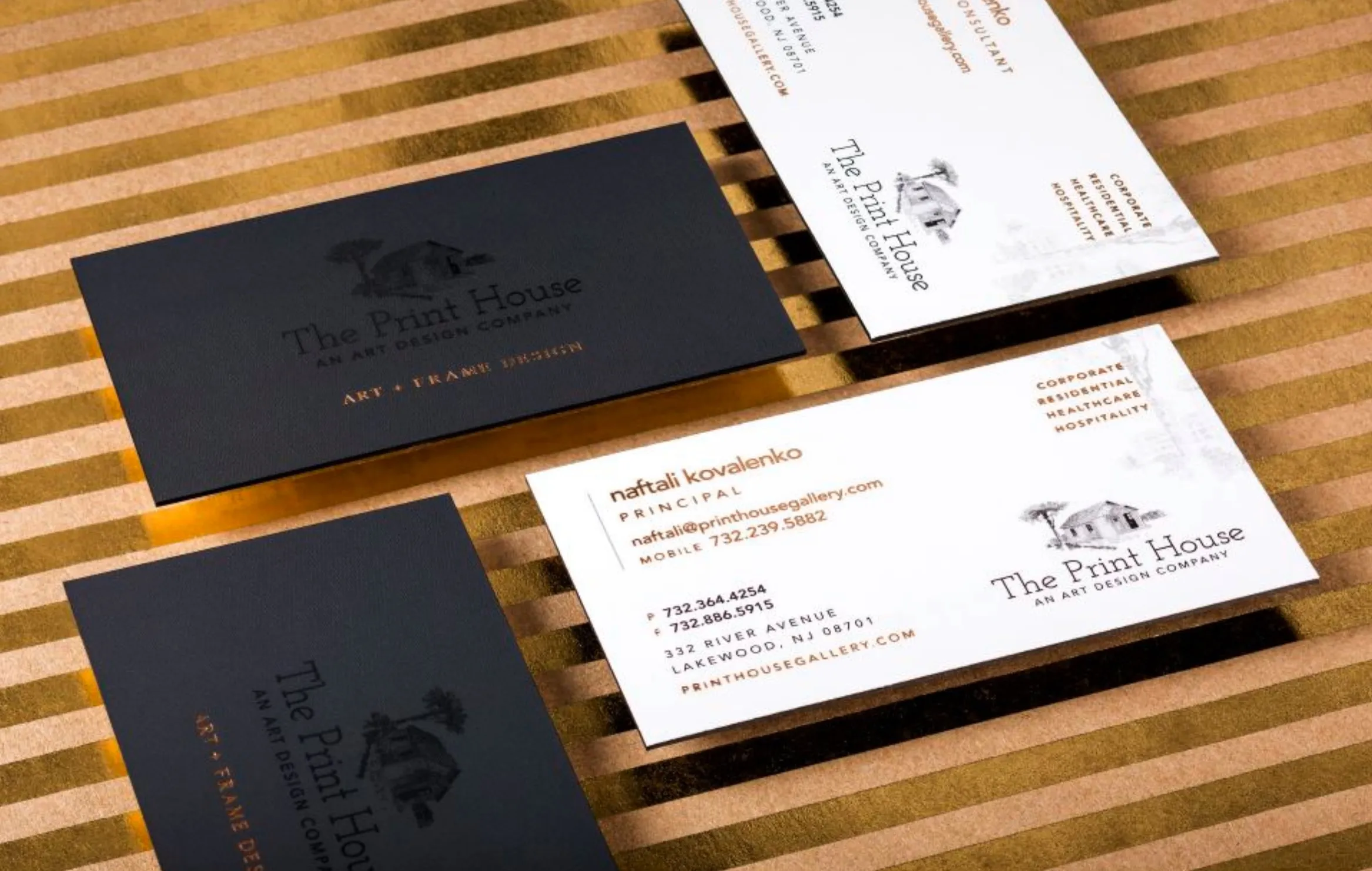 Variety of business cards and custom flyers on a table, highlighting affordable printing services