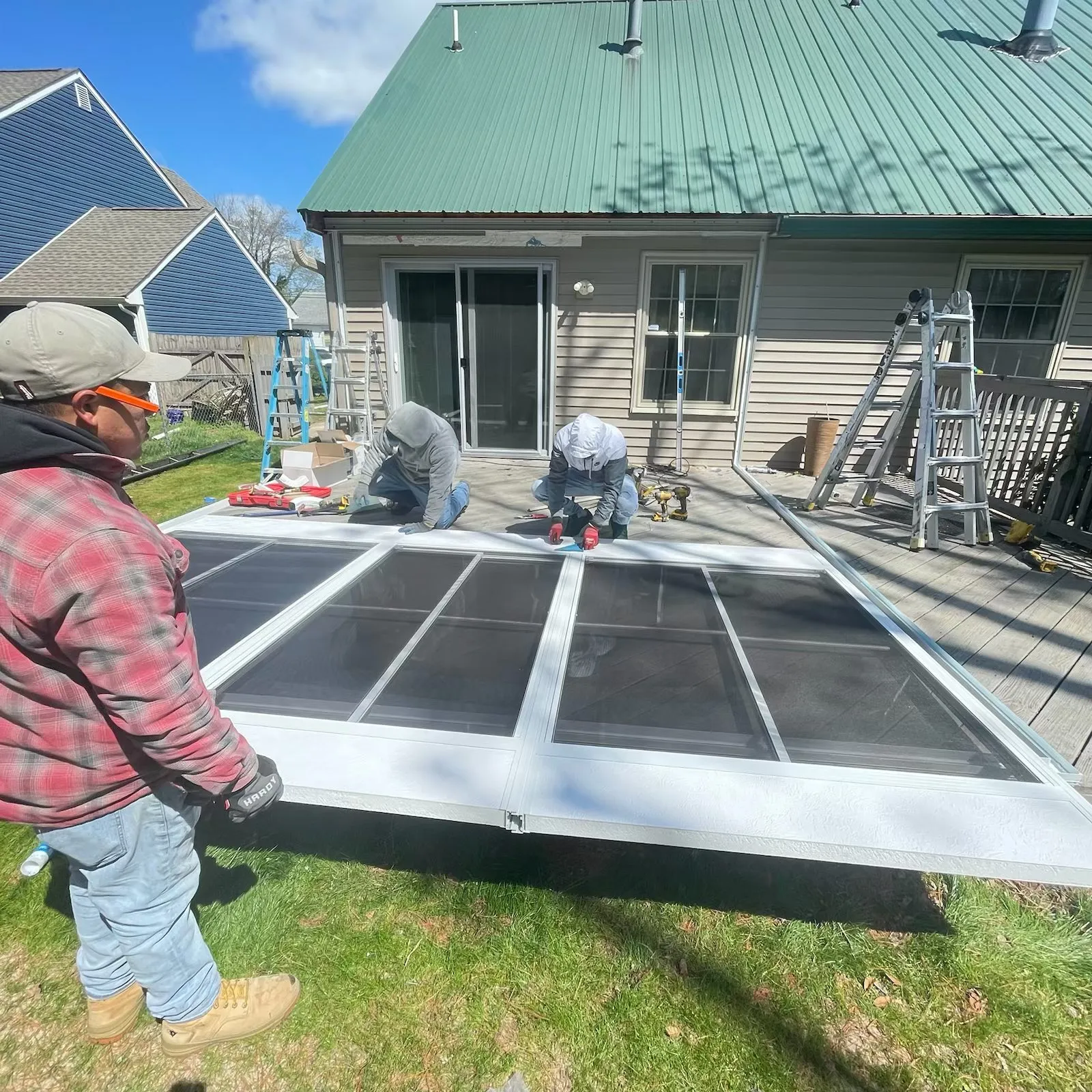 Coastline Sunrooms and Awnings installation team completing sunroom project in Selbyville Delaware