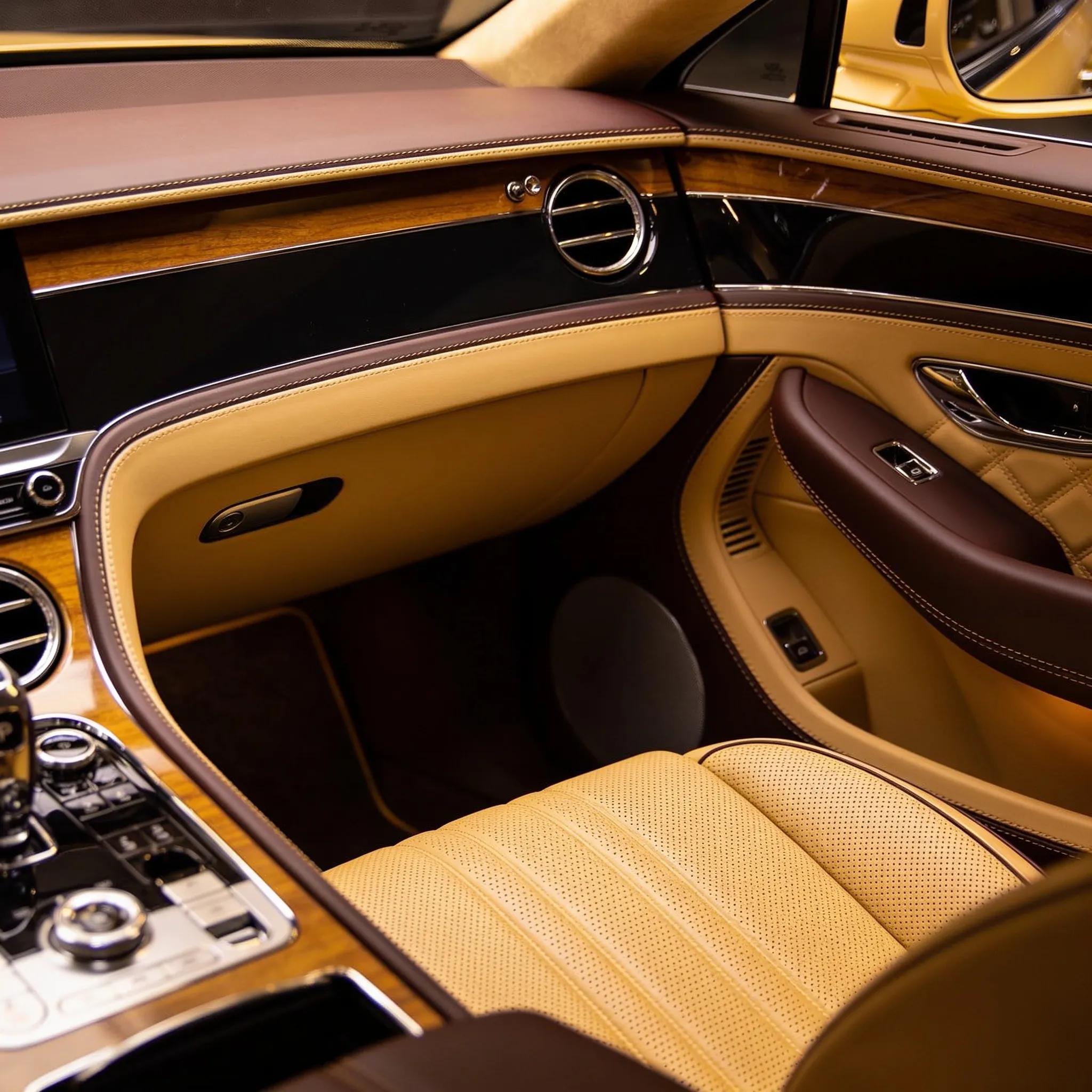 Luxury car interior highlighting pristine leather seats and detailed finishes