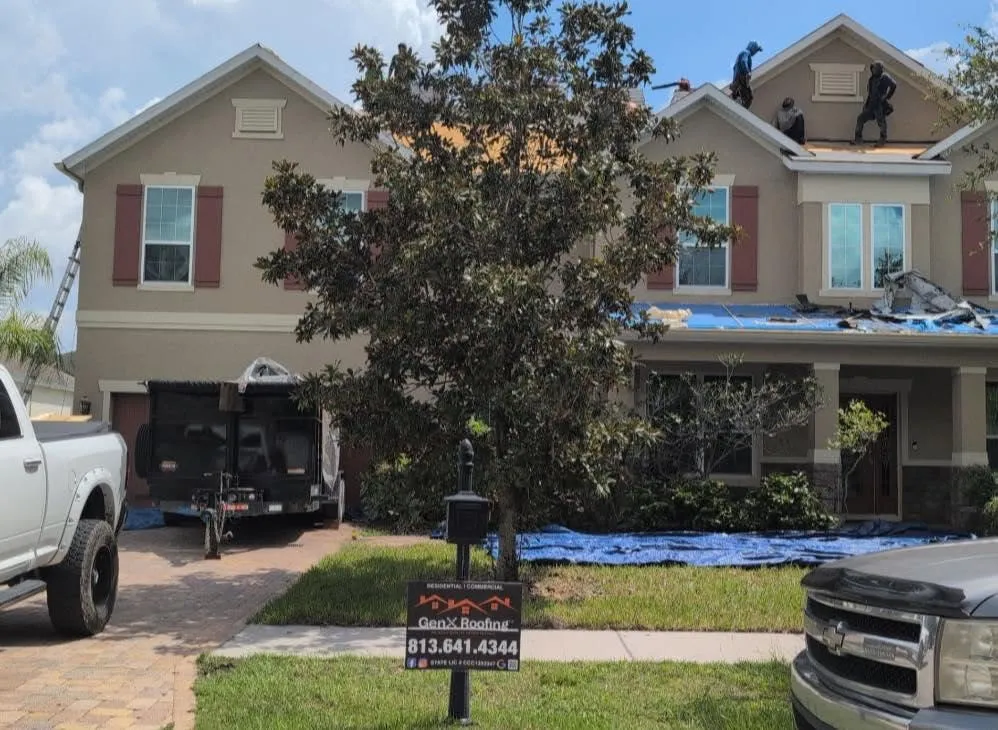GenX Roofing working on a property showing materials and labor components