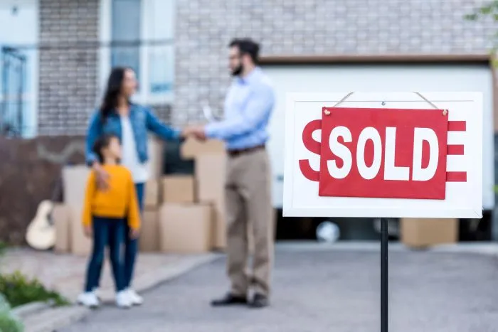 Realtor following up with clients over coffee