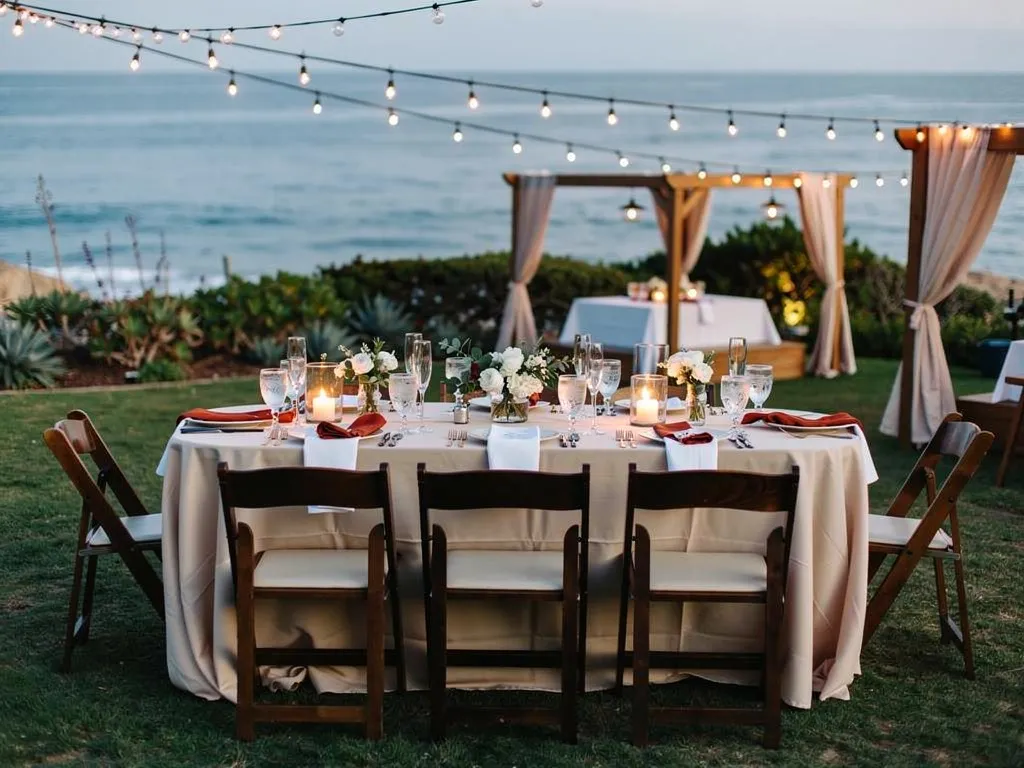 outdoor Santa Barbara wedding table setting with crystal glassware coastal florals and elegant linen tablescape