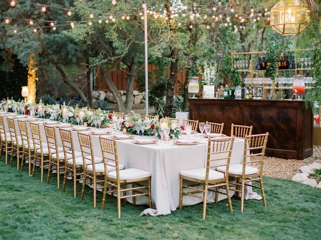 complete wedding event rental tablescape with coordinated glassware china linens chargers florals and styled bar