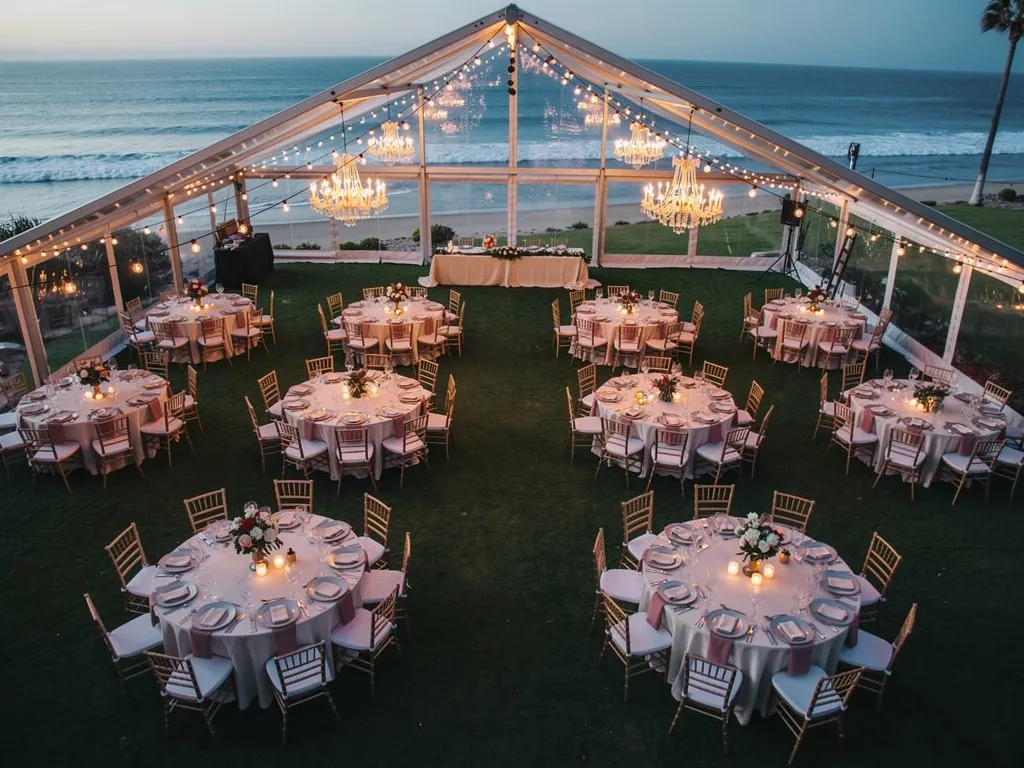 aerial view of luxury wedding reception hall with round dining tables elegant place settings and
