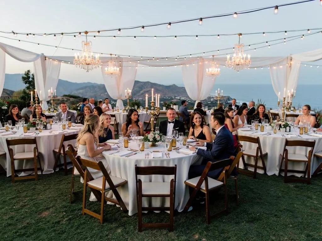 luxury wedding dining room with white linen tables candelabras crystal glassware and floral centerpieces