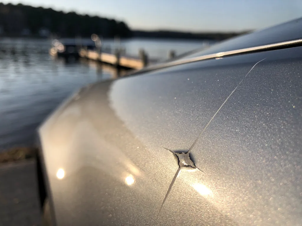 Car scratch and chip near Lake Norman, requiring mobile auto paint repair.