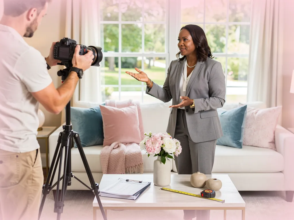 Professional photographer setting up a camera to shoot a staged home interior