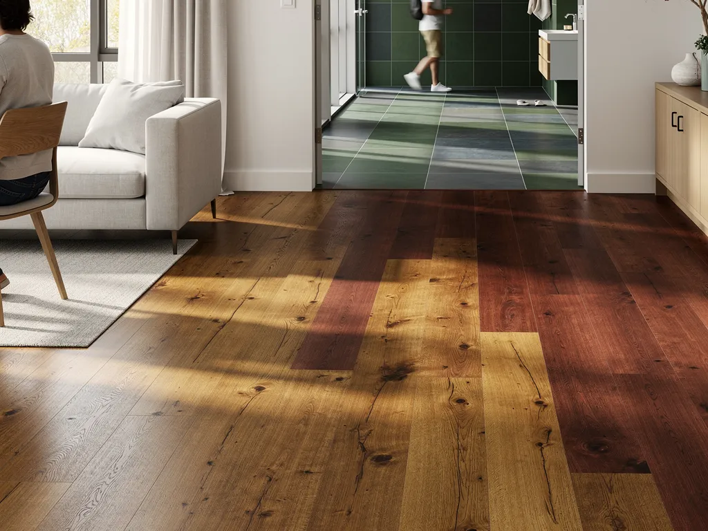 Amber and cognac-toned wood flooring samples showing 2026 color trends