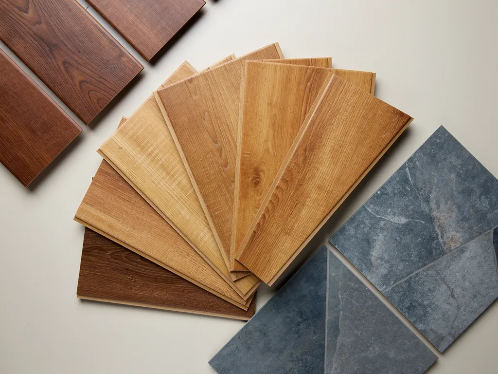 Amber and cognac-toned luxury vinyl plank flooring samples