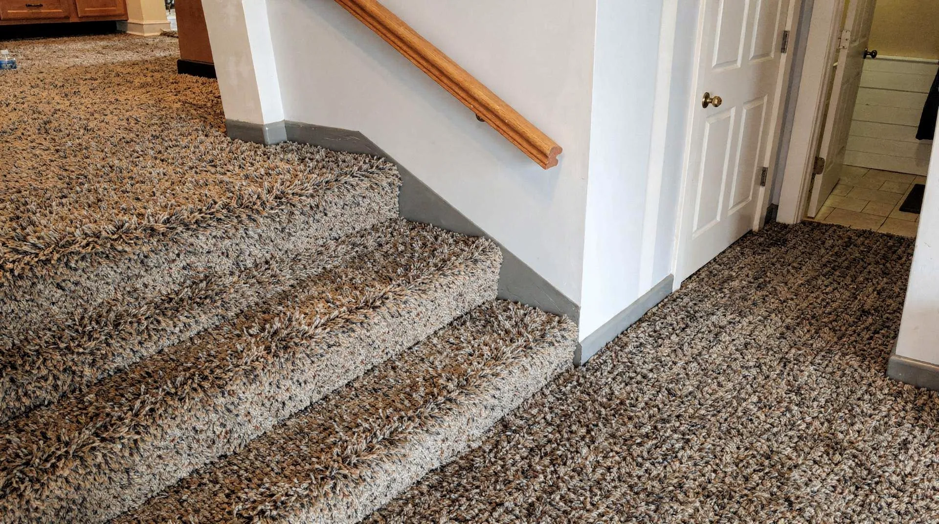 Carpeted staircase demonstrating durability and comfort for Connersville homes.