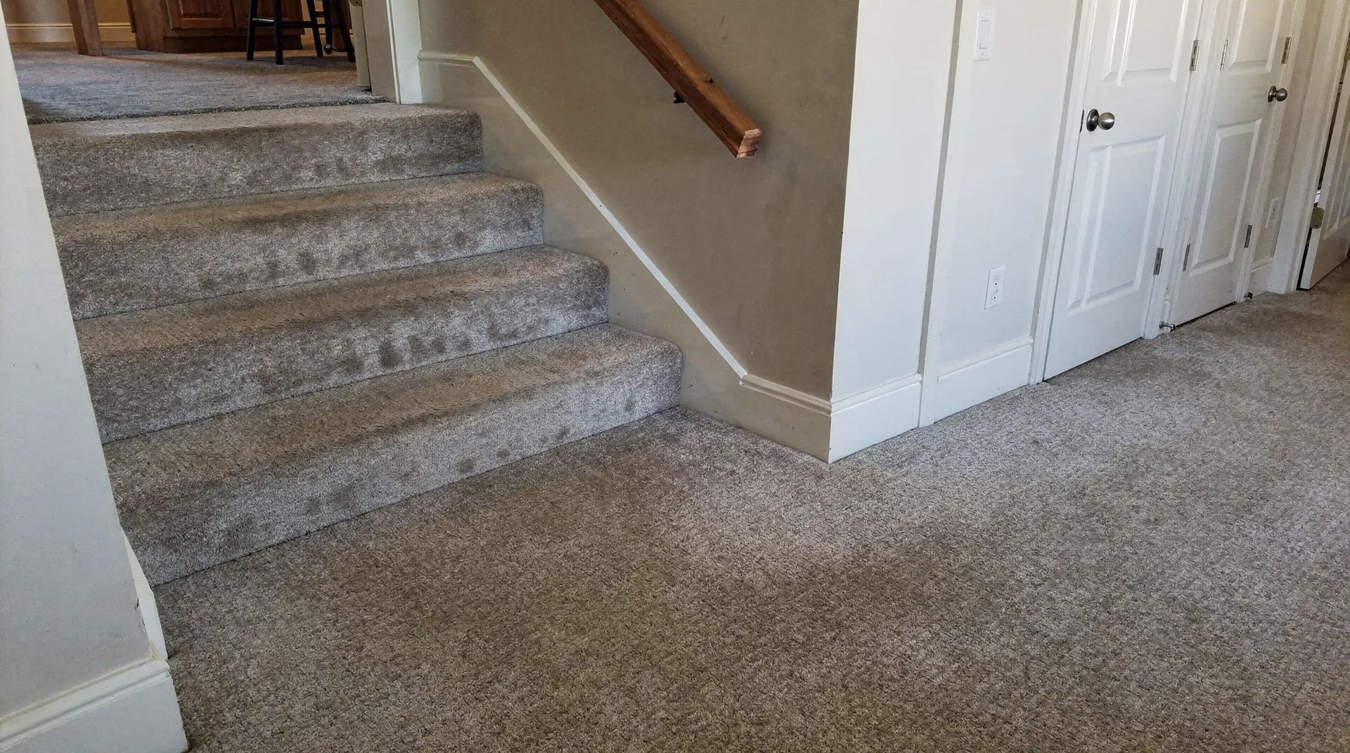 Newly installed carpet on stairs and landing, demonstrating carpet installation process.