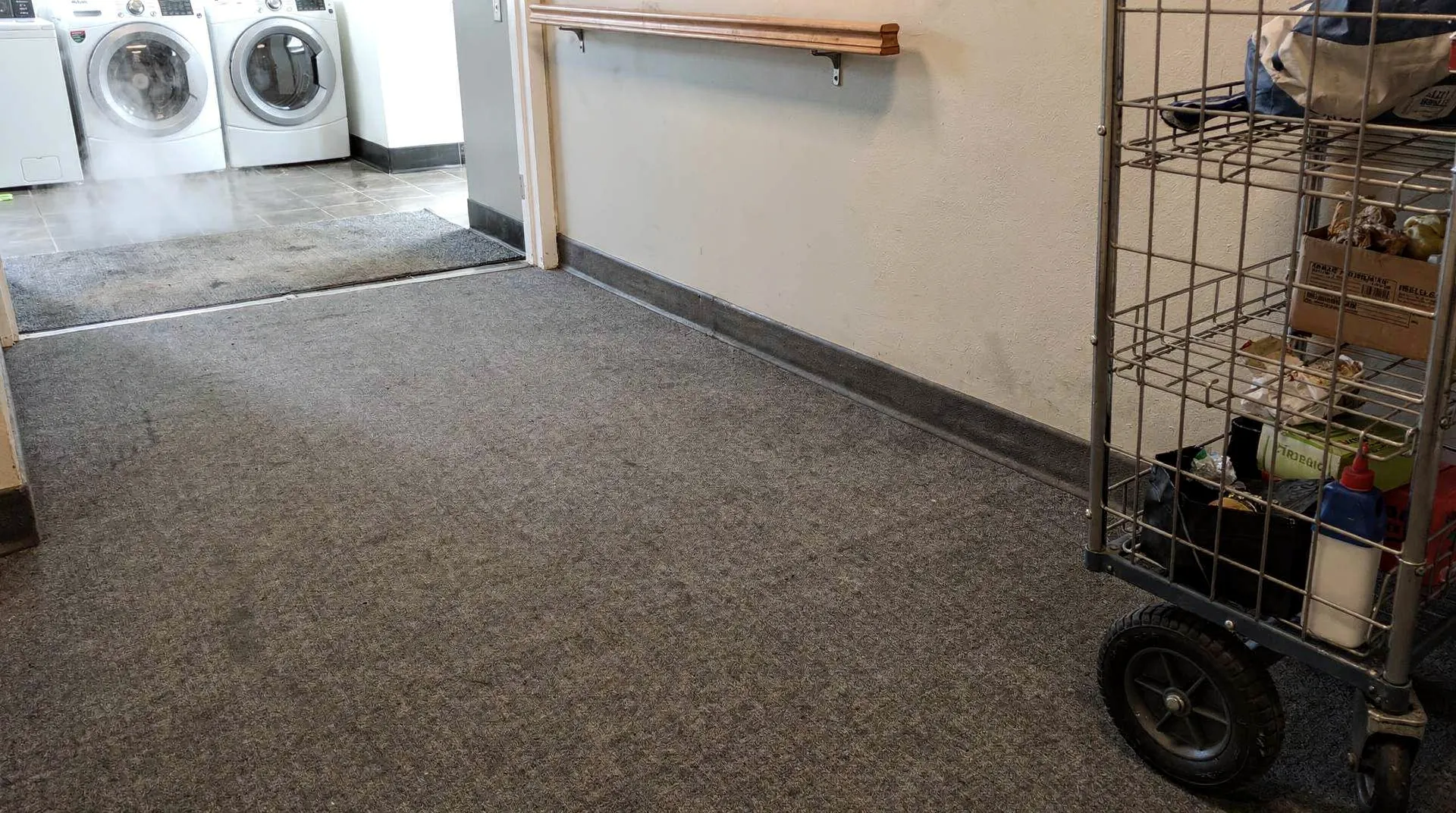 Carpet installation detail and subfloor preparation in a Connersville, Indiana business setting.