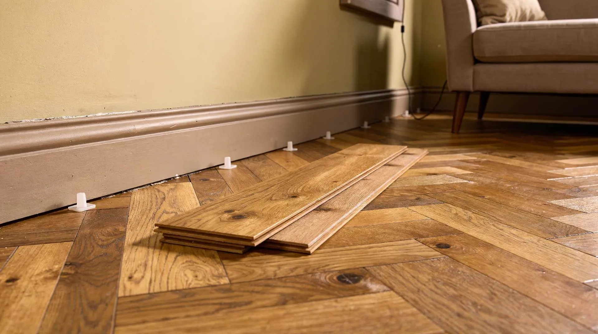 Surface scratches and small dents on engineered wood floors respond well to home repair