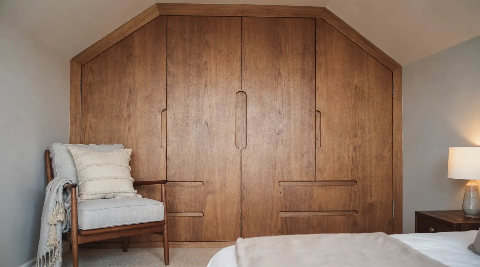 Custom timber wardrobes solve the awkward bedroom nook that standard flat-pack sizes never quite cover