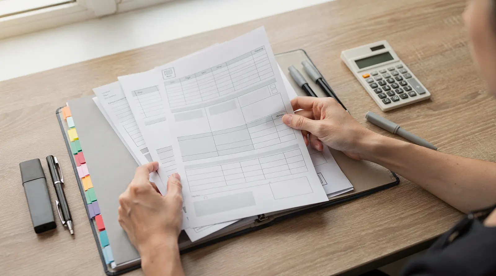 four categories of financial templates laid out on a desk