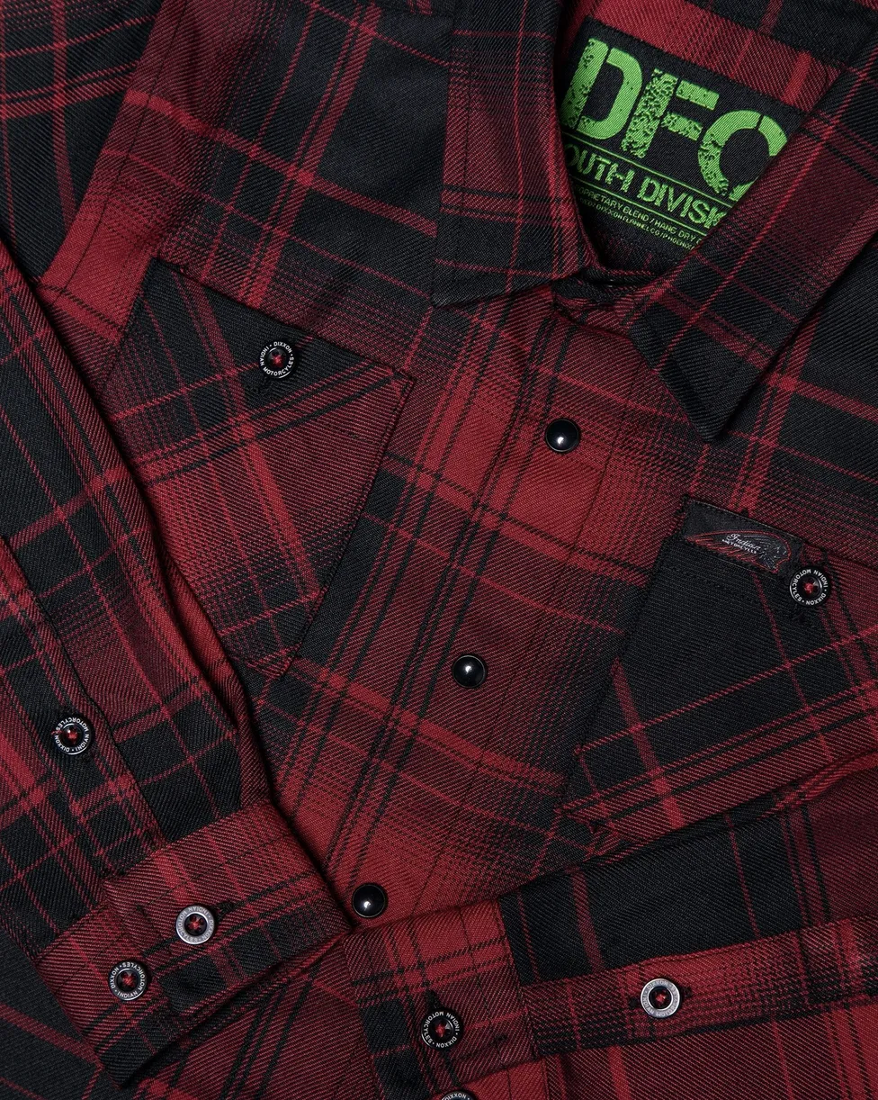 A close-up view of a red and black Dixxon flannel highlighting the signature D-Tech™ blend fabric, mitered edge pockets, and custom Indian Motorcycle hardware.