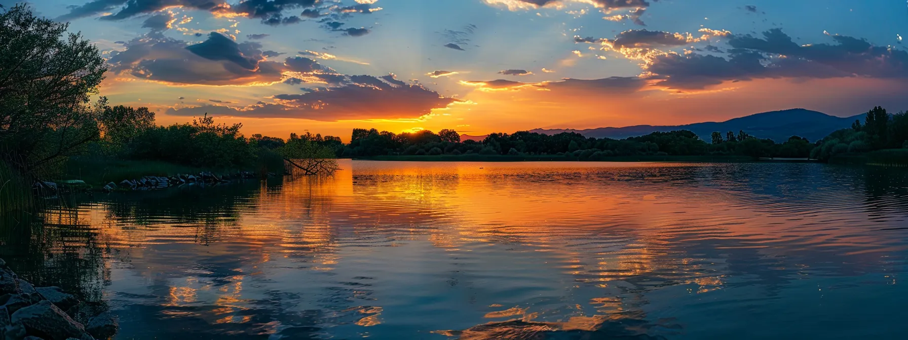 a peaceful, serene sunset over a calm lake.