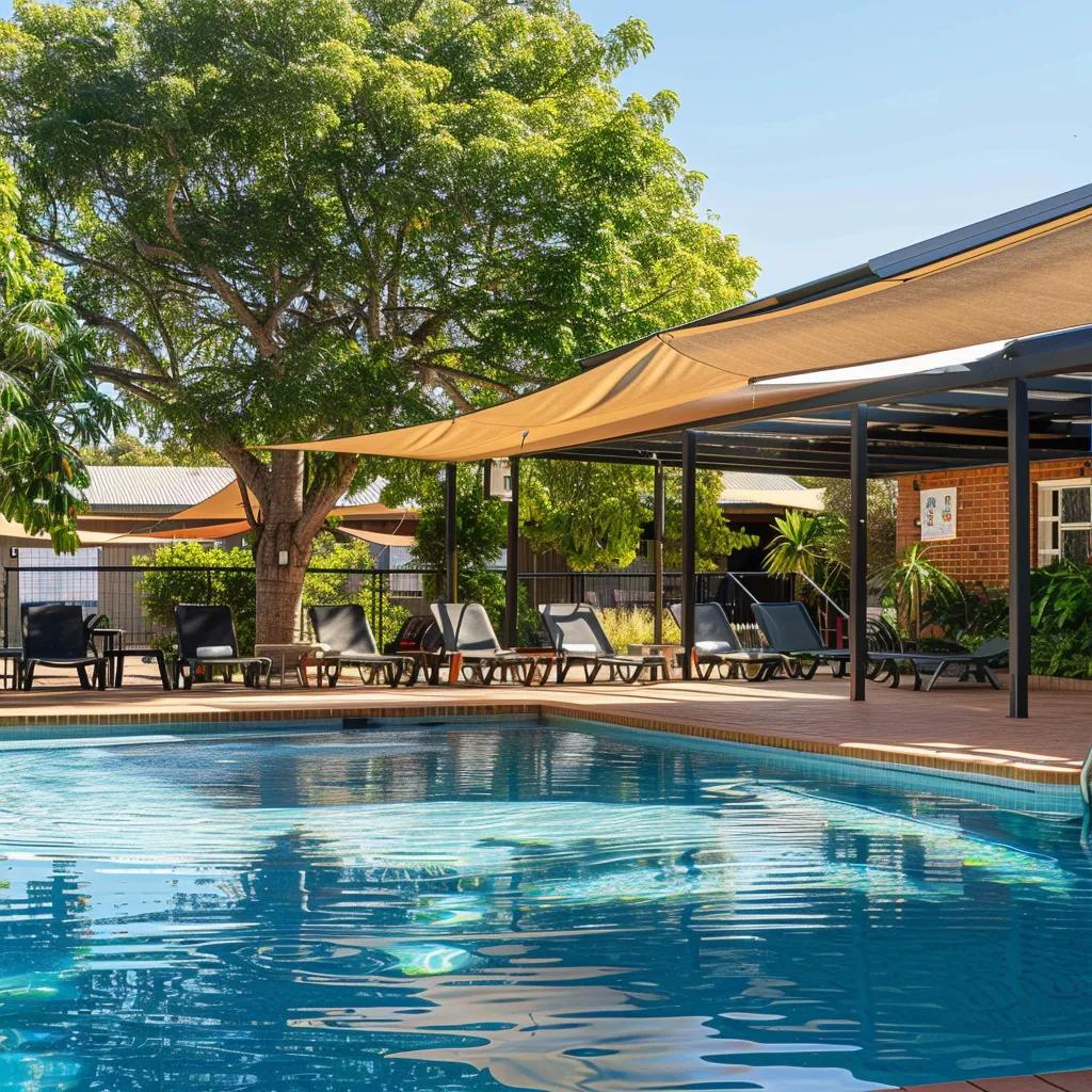 Outdoor swimming pool at Jolly Swagman Motor Inn, offering relaxation and leisure