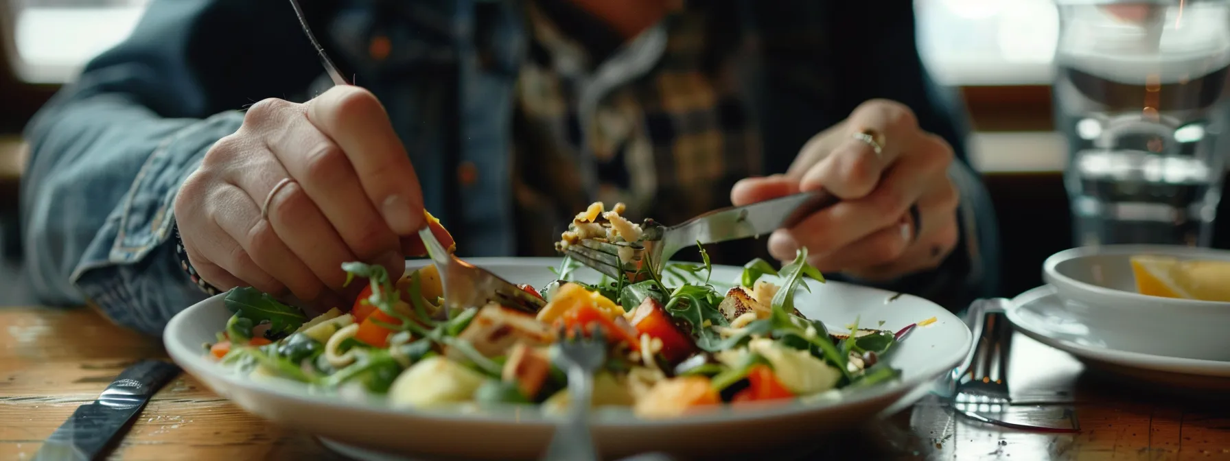 a person calmly savoring each bite of food, fully present and engaged in the act of eating.