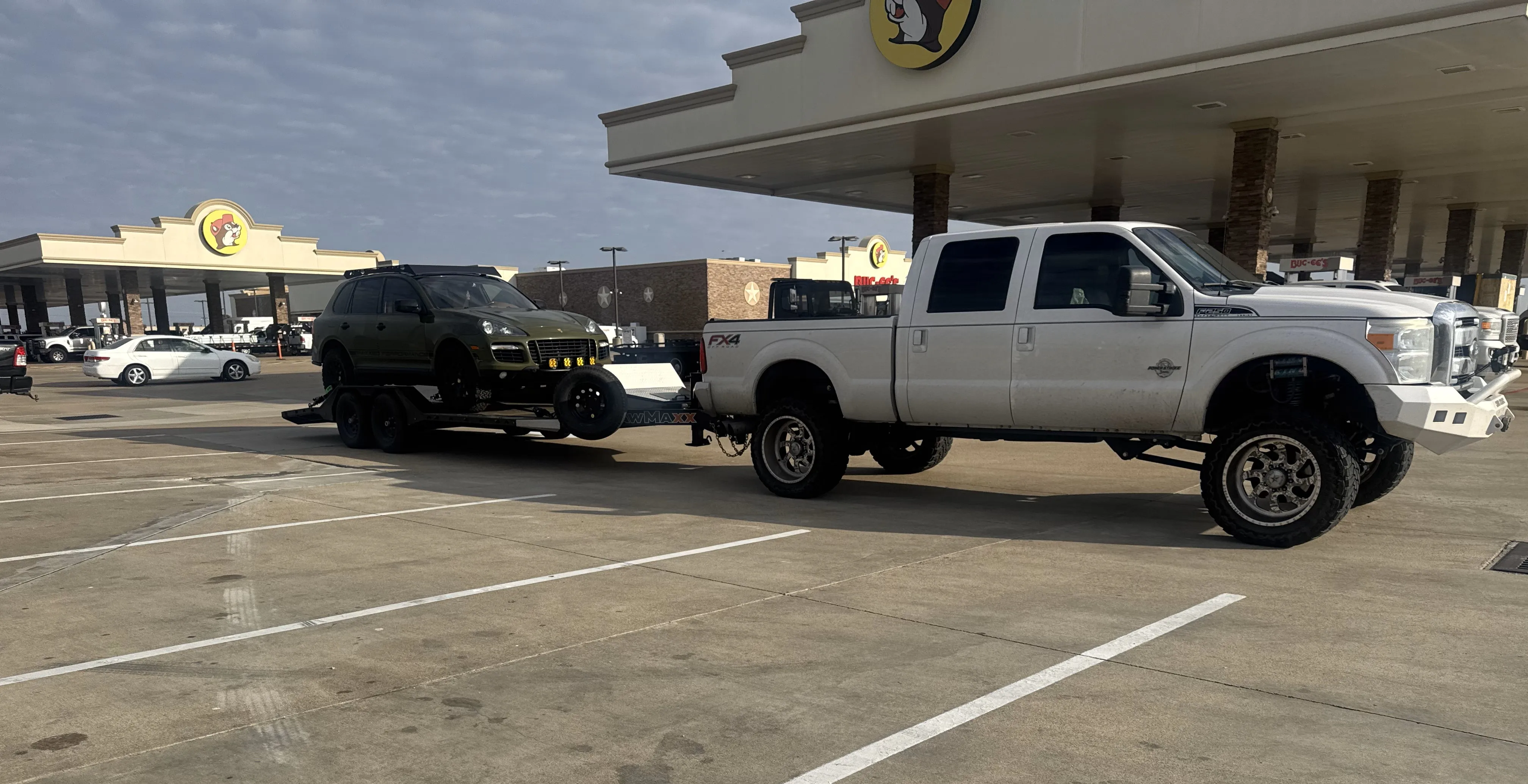 Leadfoot Rentals Car Hauler loaded with a Porsche Cayenne