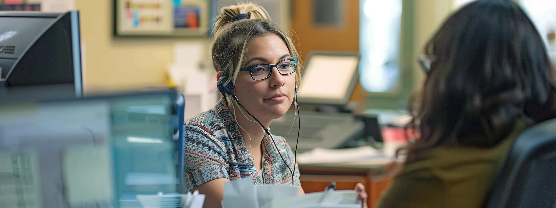 a customer service representative at colonial penn calmly assisting a policyholder with their concerns.