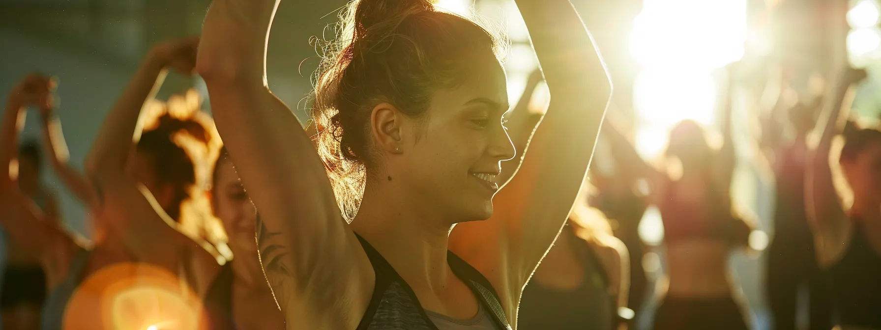 a group of individuals working together in a fitness class, cheering each other on and forming a supportive community.