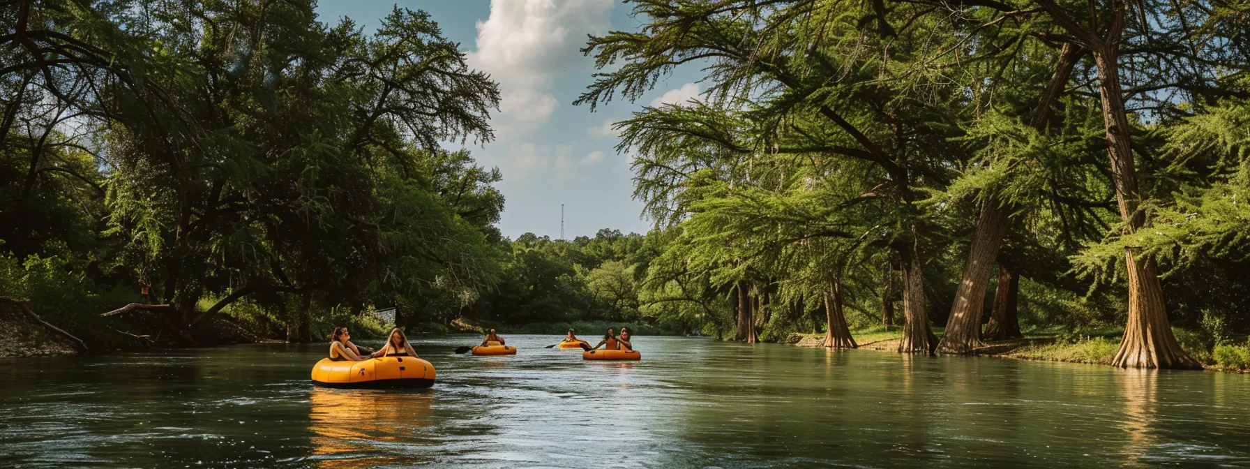 tubers floating down the guadalupe river on a sunny day.