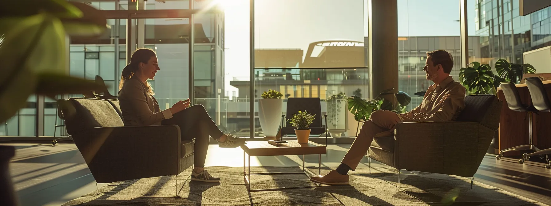 a ceo and a fitness studio owner meeting and discussing partnership plans in a modern office.