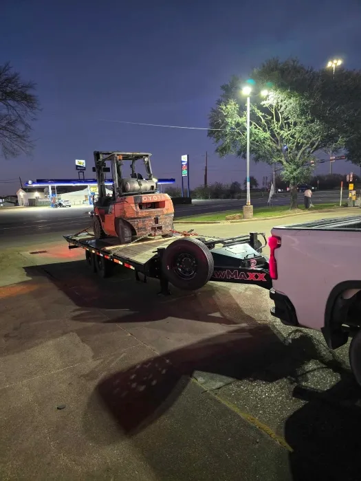 Leadfoot Rentals Tilt Deck Trailer Transporting a Forklift