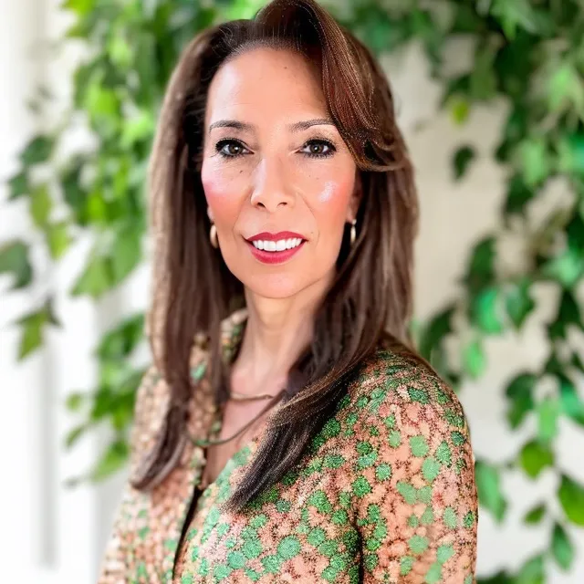 head shot of GG Sfreddo wearing green floral shirt.