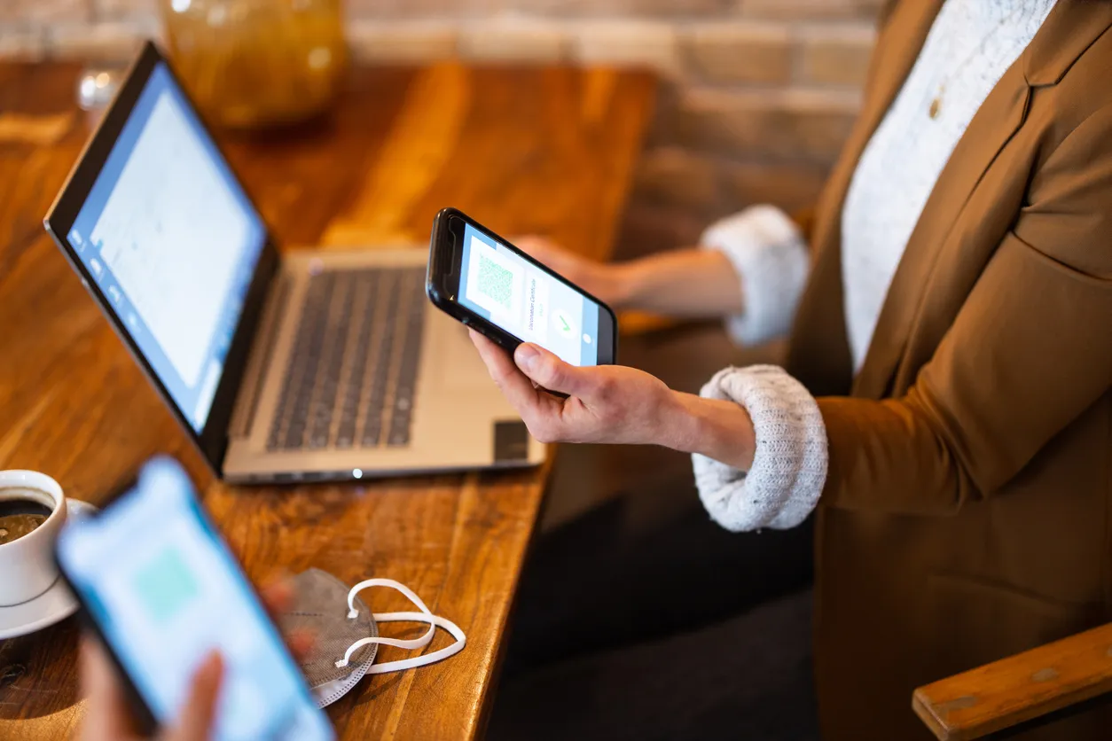 Close-up of female people tracer in Swansea with laptop.