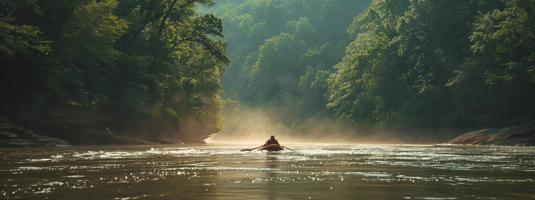 a person practicing flip recovery techniques on a raft in the ocoee river.