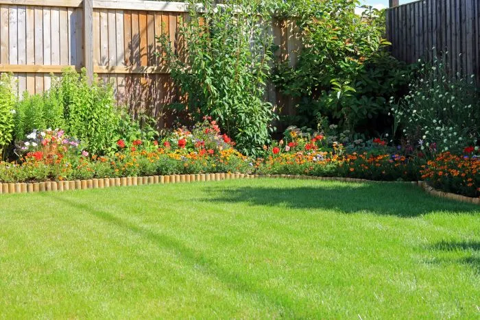 Commercial property landscaping in North Tonawanda, NY showing clean, organized grounds with trimmed bushes and green lawn