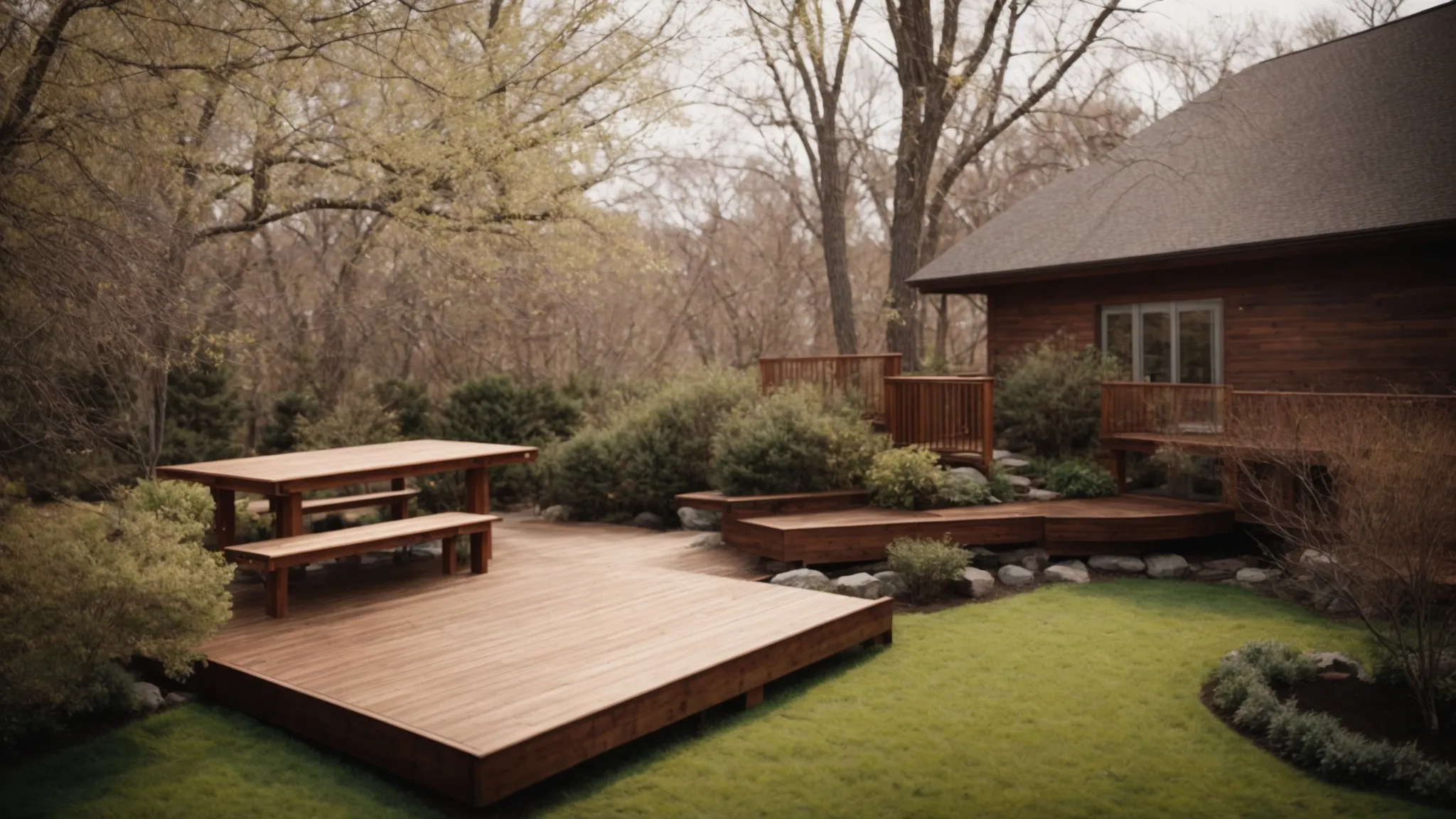 a serene backyard transitioning into spring with a half-built wooden deck, surrounded by budding trees.
