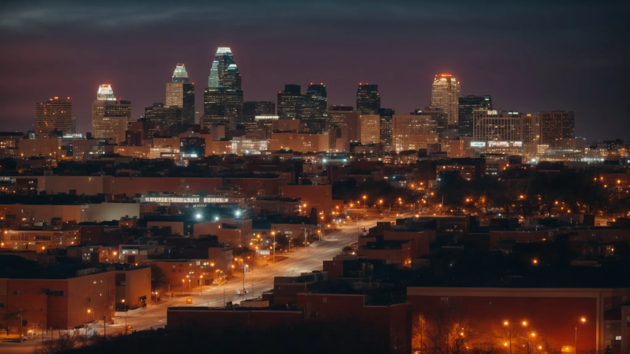 a skyline of kansas city at twilight, dotted with illuminated buildings, symbolizing the vibrant heart of the community.