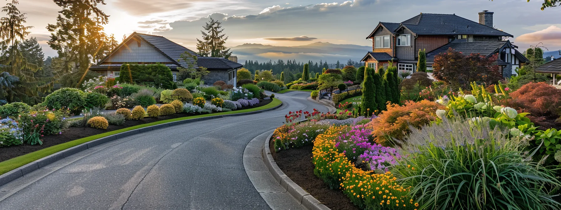 a beautifully paved asphalt driveway gracefully curves through a vibrant garden of blooming flowers, enhancing the inviting charm and modern appeal of a picturesque residential home bathed in warm, golden sunlight. a beautifully paved asphalt driveway gracefully curves through a vibrant garden of blooming flowers, enhancing the inviting charm and modern appeal of a picturesque residential home bathed in warm, golden sunlight.