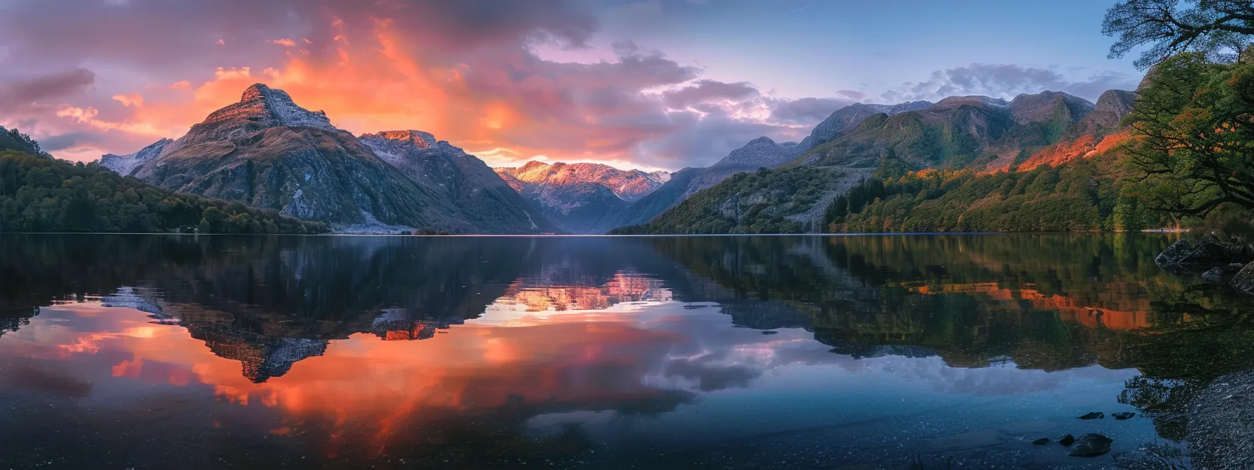 a breathtaking sunrise illuminates a tranquil lake surrounded by majestic mountains, casting vibrant reflections on the water's surface for a serene and inspiring atmosphere.