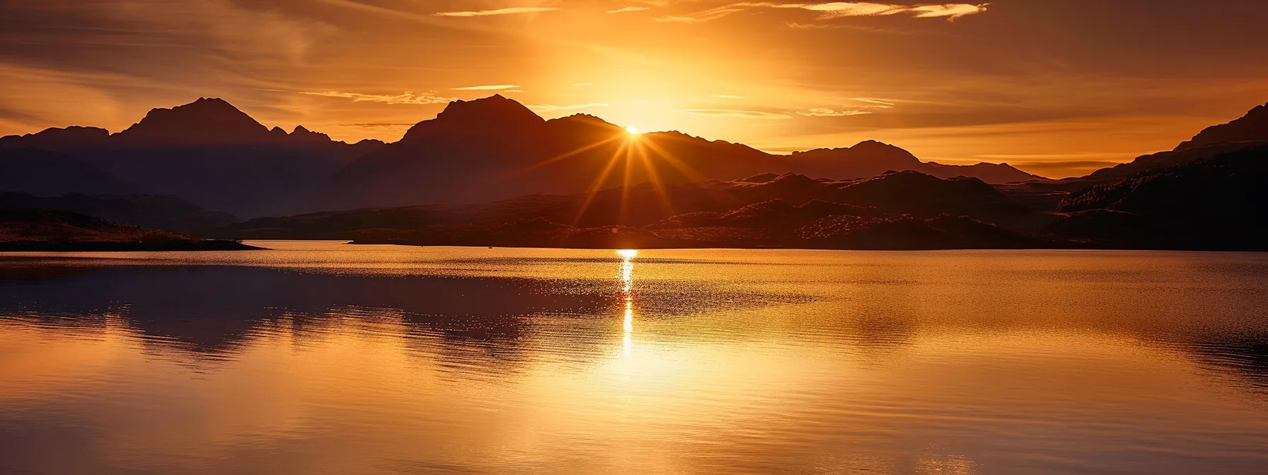 a breathtaking sunset casts golden hues over a serene lake, with the silhouette of majestic mountains reflecting perfectly in the calm waters, creating a stunning contrast of colors and tranquility. a breathtaking sunset casts golden hues over a serene lake, with the silhouette of majestic mountains reflecting perfectly in the calm waters, creating a stunning contrast of colors and tranquility.