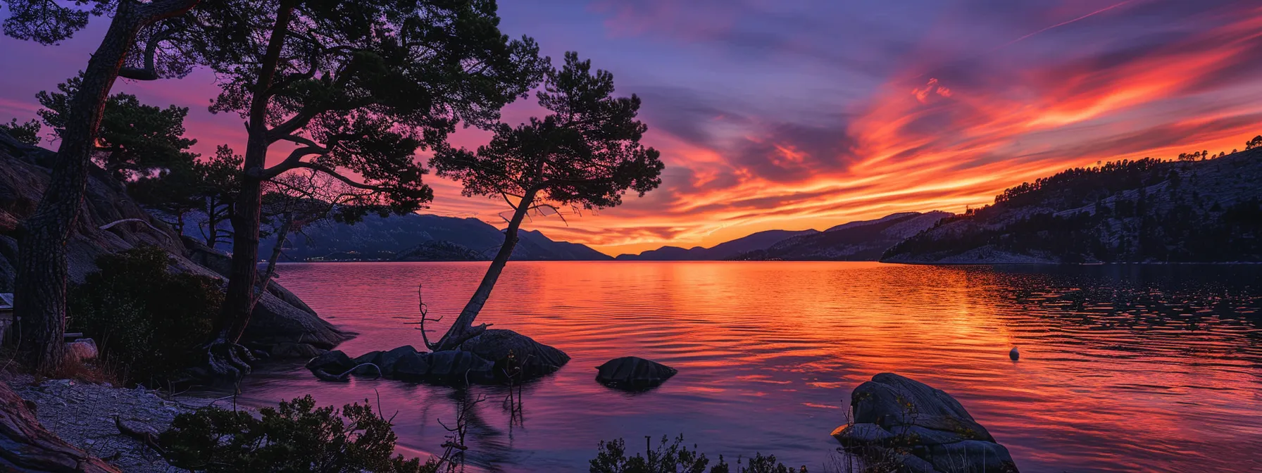 a breathtaking sunset casts a radiant glow over a tranquil lake, enveloping the scene in warm hues of orange and pink, while silhouetted trees frame the water's edge, reflecting the vibrant colors above.