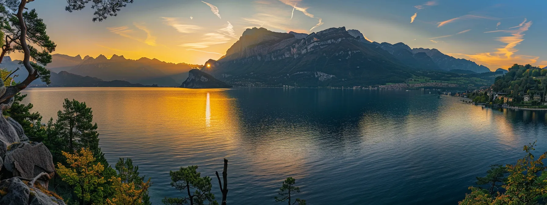 a breathtaking sunset casts a golden hue over a serene lake, reflecting vibrant hues of orange and pink, surrounded by majestic mountains under a clear sky.