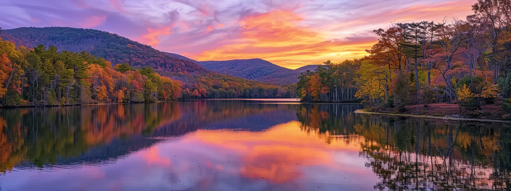 a breathtaking sunset over a tranquil lake, with vibrant hues of orange and purple reflecting on the water's surface, creates a serene and peaceful atmosphere.