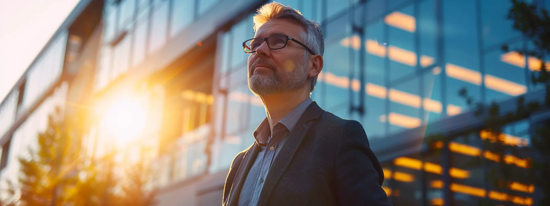 a candid shot of a confident architect standing proudly in front of a modern building, sunlight illuminating the intricate design, symbolizing the credibility and ethical standards of professional licensing in architecture.