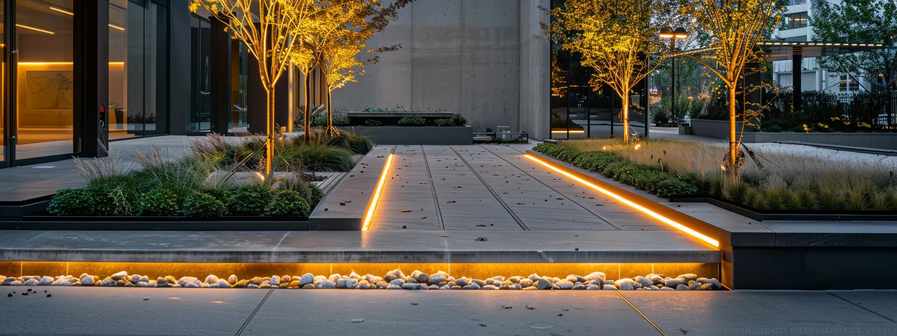 a meticulously maintained urban hardscape features sleek concrete surfaces and modern stone pathways, prominently showcasing the effects of regular upkeep with strategically placed drip irrigation systems blending into the design, all under well-illuminated evening lighting that highlights the beauty and durability of the structures. a meticulously maintained urban hardscape features sleek concrete surfaces and modern stone pathways, prominently showcasing the effects of regular upkeep with strategically placed drip irrigation systems blending into the design, all under well-illuminated evening lighting that highlights the beauty and durability of the structures.