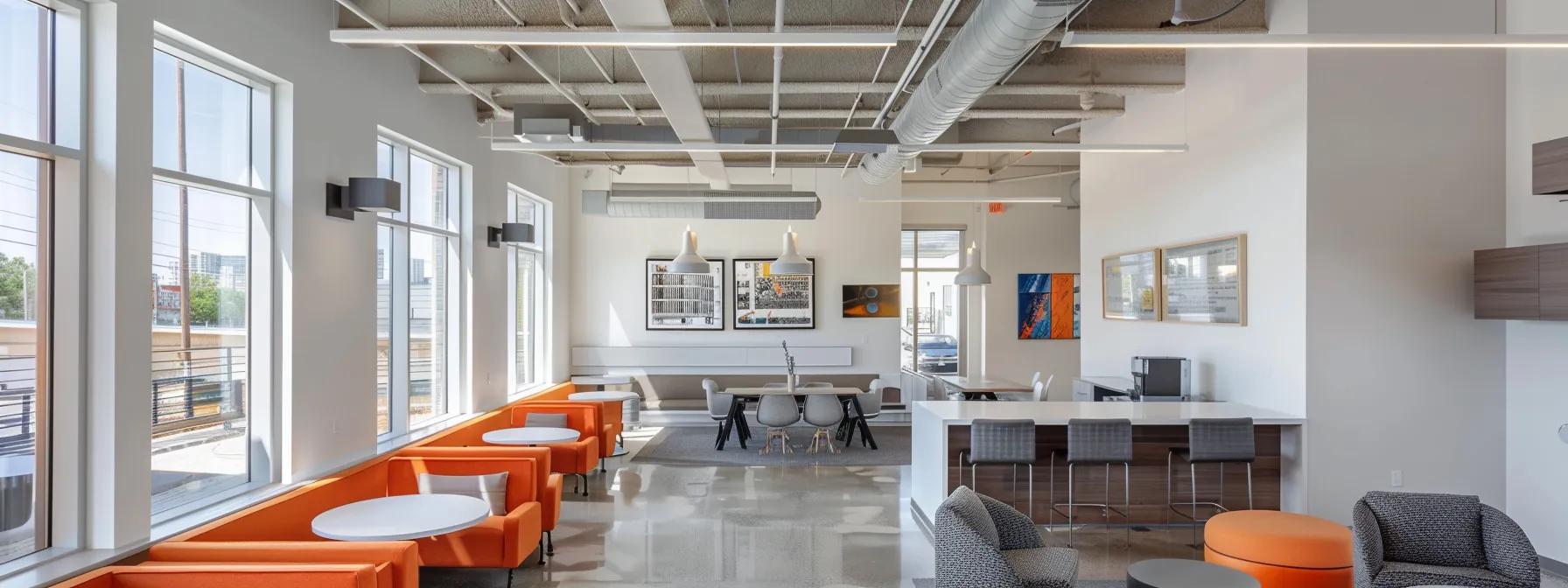 a modern, clean office space showcases a sleek ductless mini-split air conditioning system mounted elegantly on a crisp white wall, juxtaposed with a visible section of complex ductwork illustrating the invasive installation of a central hvac system.