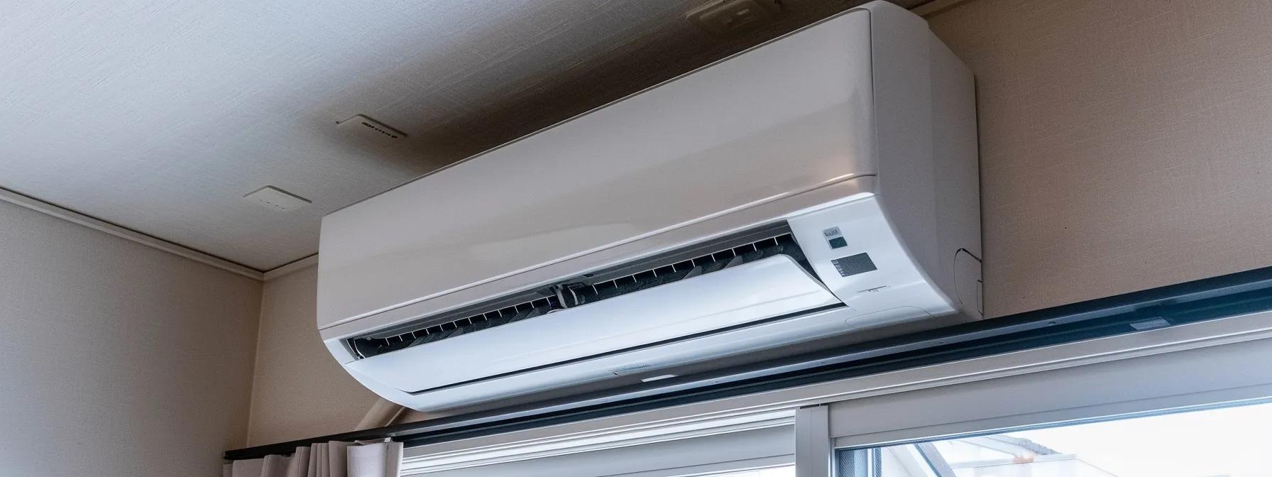 a modern, sleek indoor living space showcases an efficient mini split air conditioning system mounted on a stylish wall, with clear visibility of the elegant indoor air handler and a glimpse of the outdoor condenser through a nearby window, emphasizing the sophisticated design and functionality of the installation. a modern, sleek indoor living space showcases an efficient mini split air conditioning system mounted on a stylish wall, with clear visibility of the elegant indoor air handler and a glimpse of the outdoor condenser through a nearby window, emphasizing the sophisticated design and functionality of the installation.