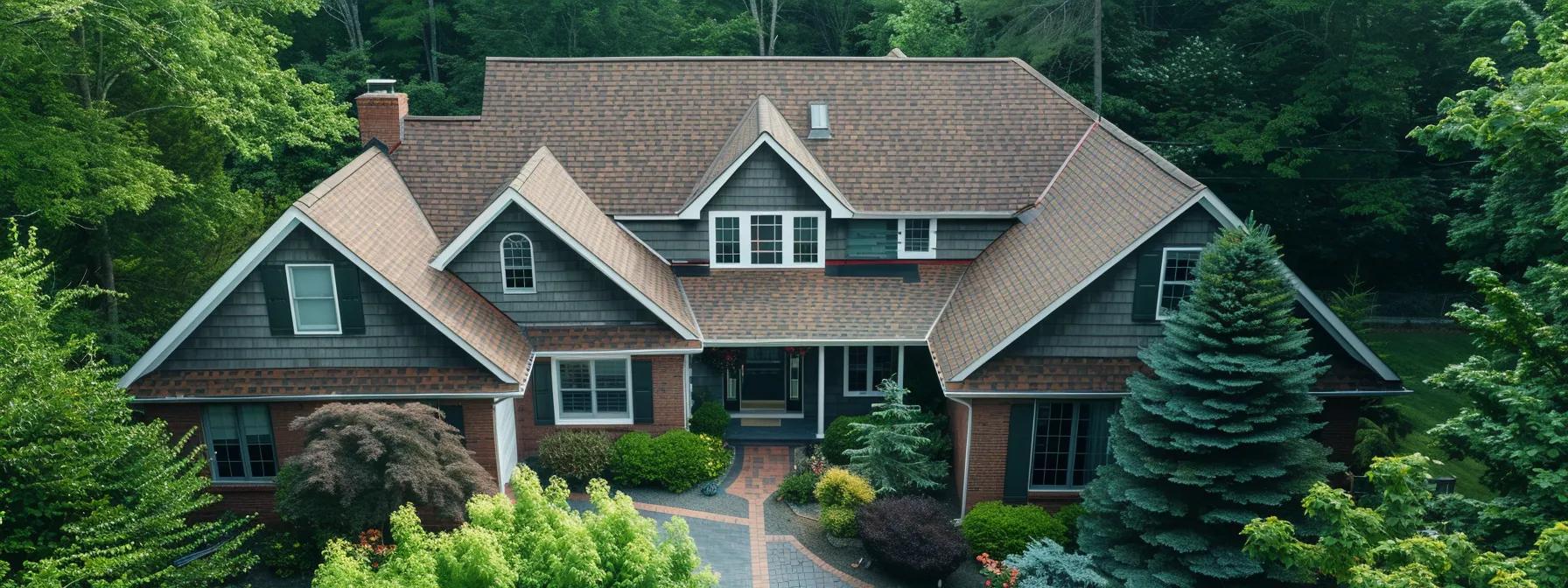 a professional contractor inspects a meticulously maintained shingle roof from an elevated position, highlighting the importance of regular maintenance and high-quality materials in preventing leaks and extending roof longevity. a professional contractor inspects a meticulously maintained shingle roof from an elevated position, highlighting the importance of regular maintenance and high-quality materials in preventing leaks and extending roof longevity.