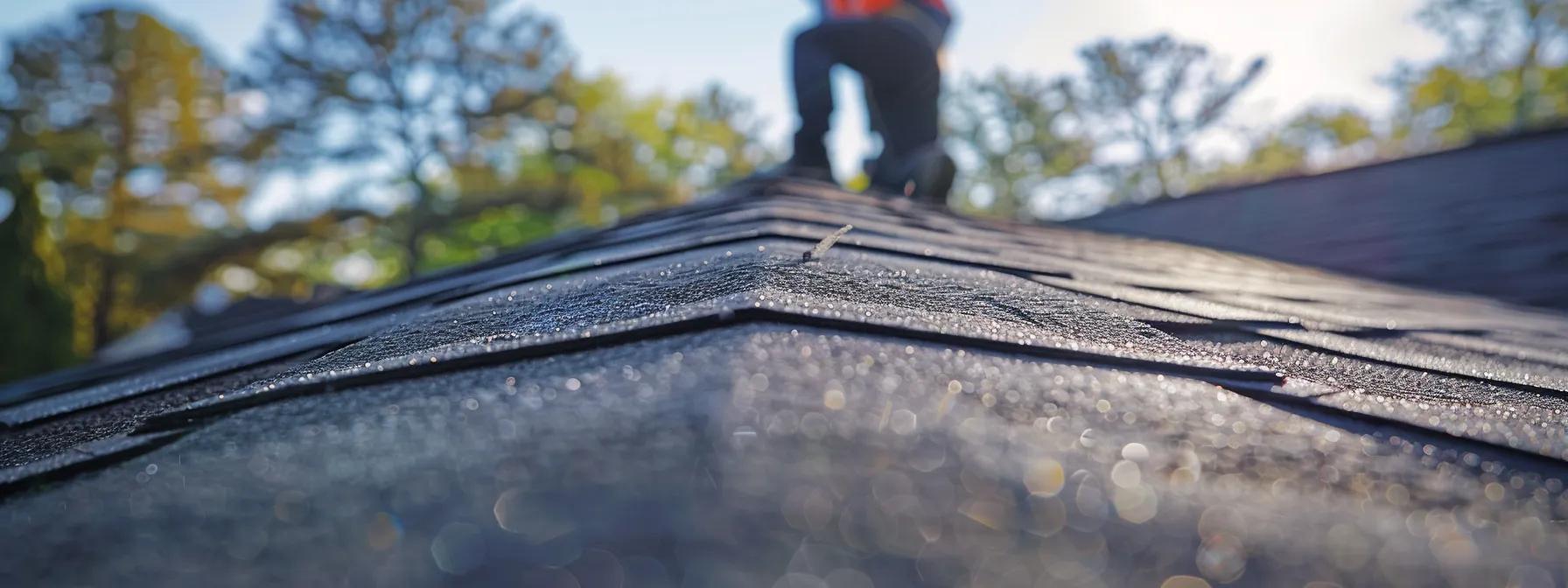 a professional contractor inspects a sleek asphalt shingle roof on an urban building, with various roofing materials like metal and tiles prominently displayed on a nearby table, showcasing the diverse options and costs of roofing installation in missouri. a professional contractor inspects a sleek asphalt shingle roof on an urban building, with various roofing materials like metal and tiles prominently displayed on a nearby table, showcasing the diverse options and costs of roofing installation in missouri.