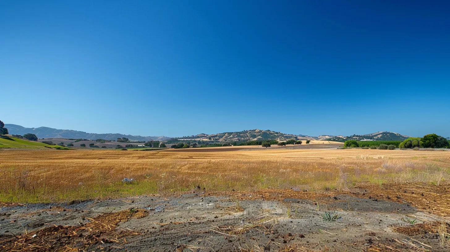 a serene landscape of a spacious, undeveloped lot under a bright blue sky, showcasing the untapped potential of custom home construction amidst softly rolling hills and a clear horizon, emphasizing the importance of land prices in building dreams. a serene landscape of a spacious, undeveloped lot under a bright blue sky, showcasing the untapped potential of custom home construction amidst softly rolling hills and a clear horizon, emphasizing the importance of land prices in building dreams.